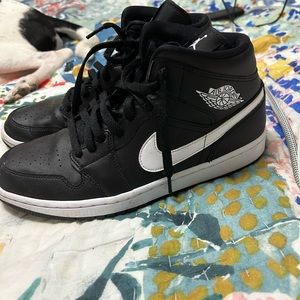 Air Jordan mids in black and white, women’s 11